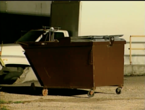 dumpster in parking lot